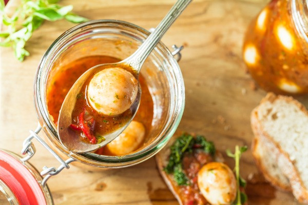 a soup with quail eggs and red hot chili