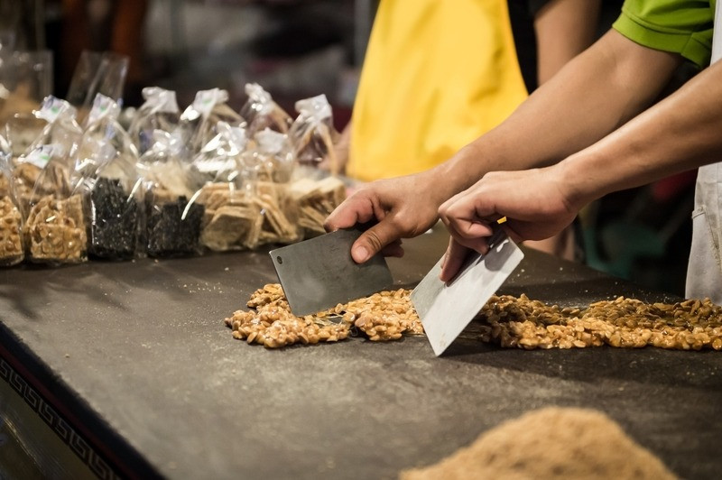 Closeup of chef`s hand making dessert for sale